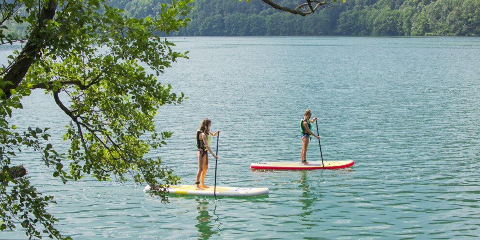 Go stand-up paddleboarding around Blue Flag lakes