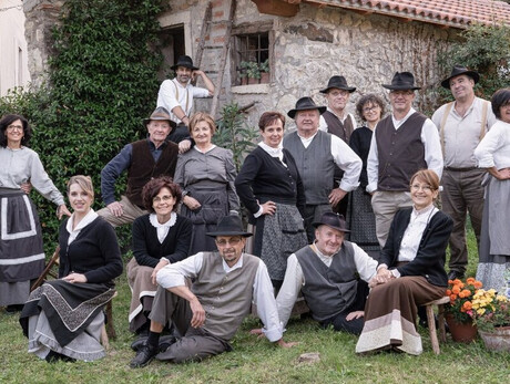 image of a group of men and women wearing traditional clothes from the past