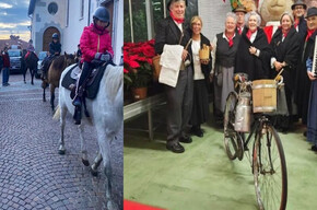 KINDER AUF PFERDEN IM DORFZENTRUM