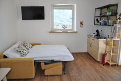 Divano letto e cucina