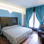  Foto von Dreibettzimmer mit Wiege