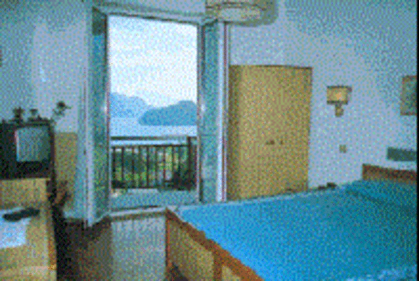 Room with balcony andlake view
